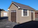 10x14 Cape Cod Shed in Java Vinyl Siding and Burnished Slate Metal Roof